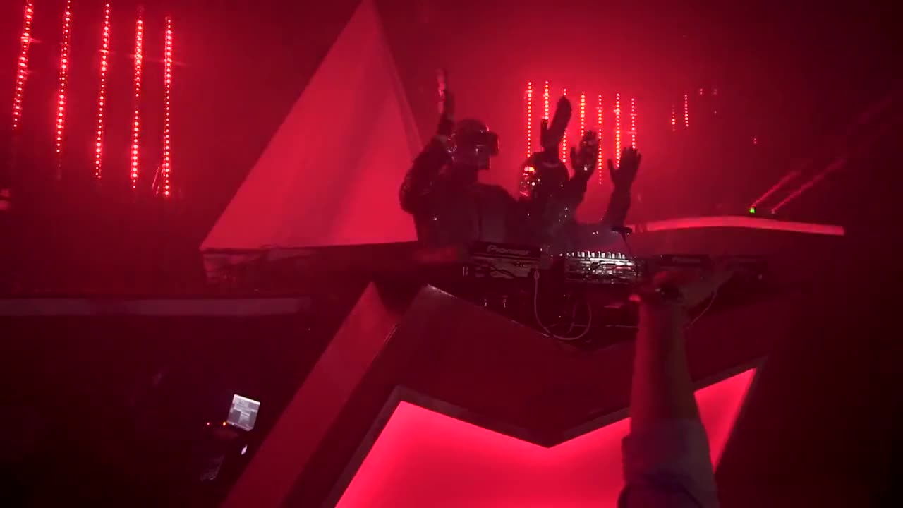 Stage under red lights at a tribute party