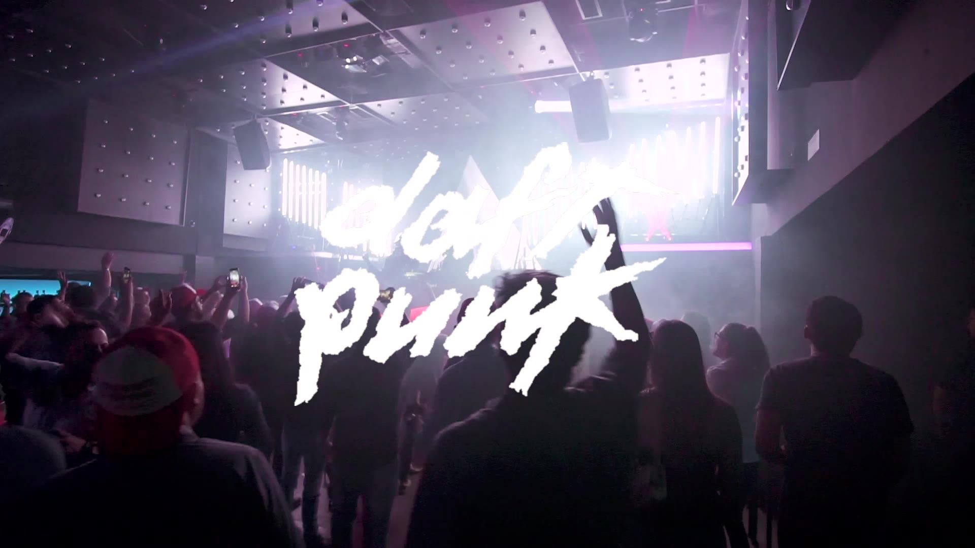 Daft Punk logo projected over the crowd