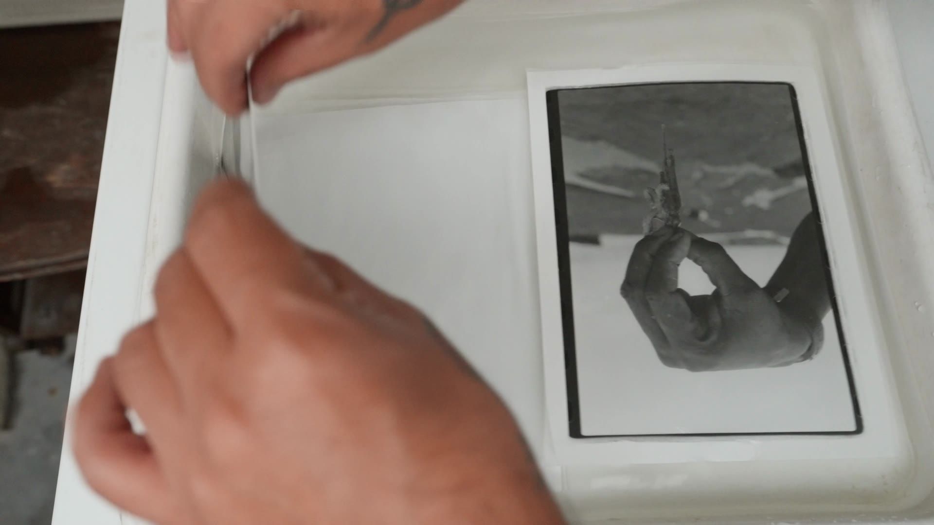 Black-and-white print in the developing tray