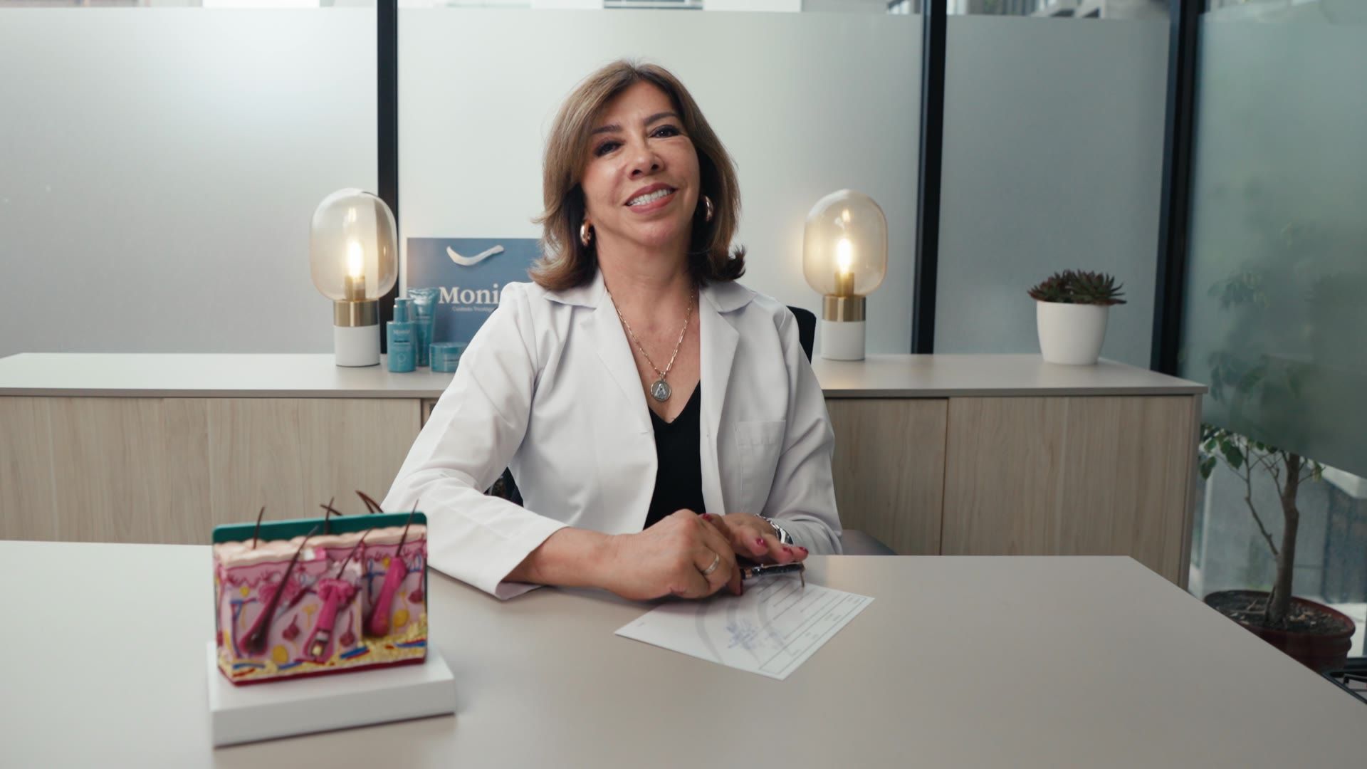 Mónica Carrera at her desk